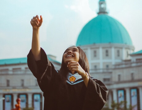 International student throwing cap