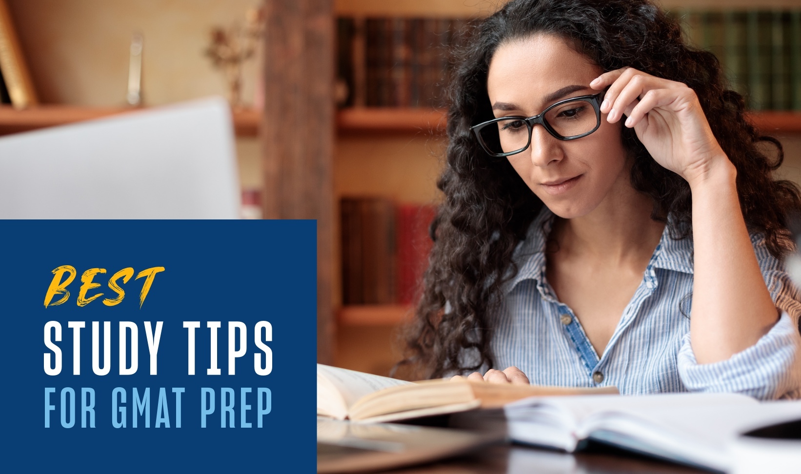 woman-studying-at-her-laptop-with-a-textbook-open.