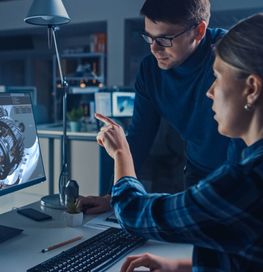 two-tech-leads-working-at-a-computer-together.