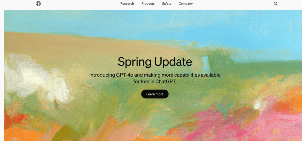 Image of open AI homepage with bright pastel abstract background and "spring update" in the foreground