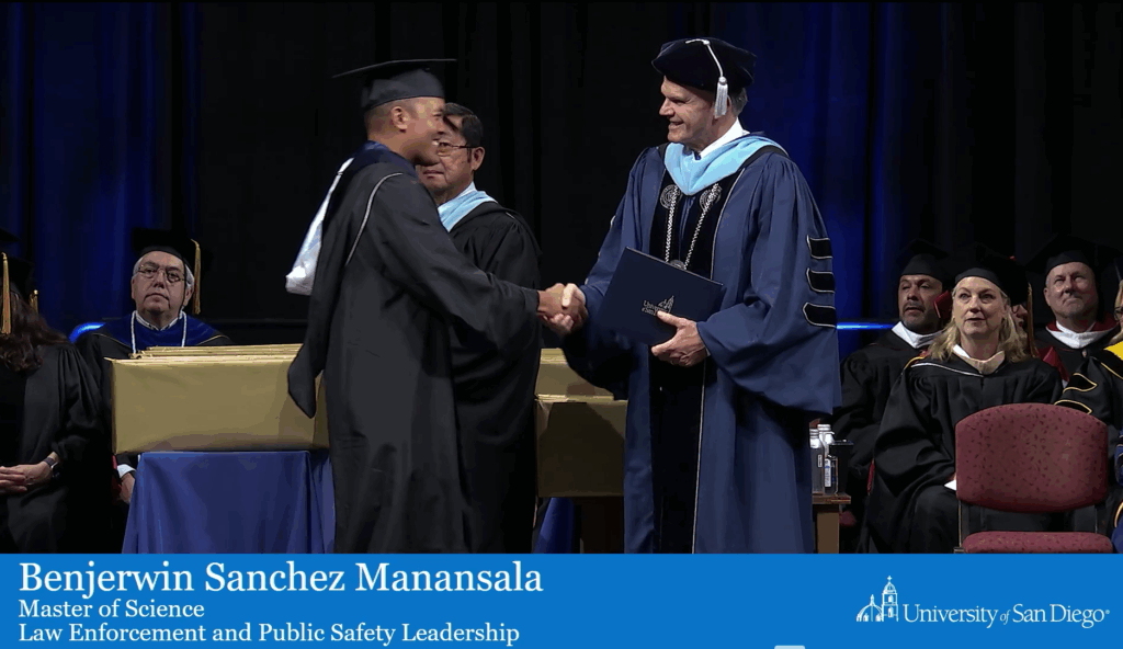 Commander Benjerwin Manansala receives his degree as the 1000th graduate of the MS-LEPSL program