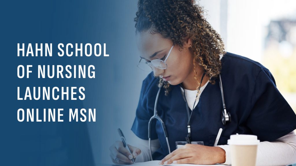 A woman with glasses and curly brown hair writes in a notebook with a pen while sitting at a table with an open laptop. She is wearing dark blue scrubs and the copy reads HAHN school of nursing launches MSN.