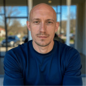 middle aged man wearing a blue sweater