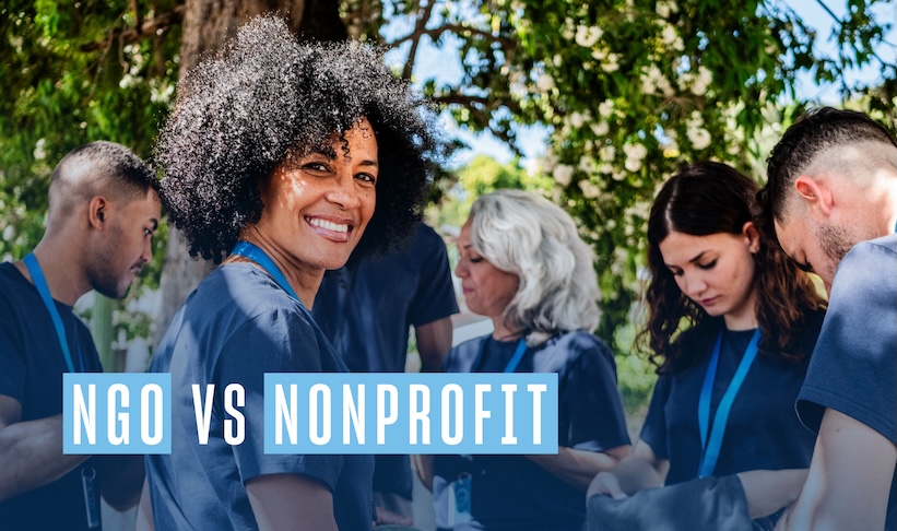 group of volunteers standing with one woman in front turning towards the camera smiling. Text reads NGO vs Nonprofit