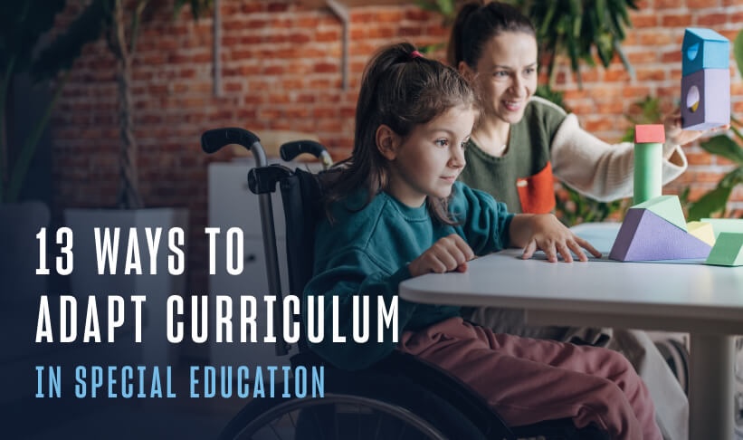a kid in a wheel chair working at a desk with a teacher with building blocks
