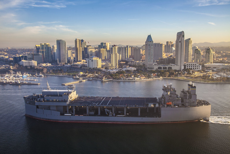 Large boat sailing by the city of San Diego