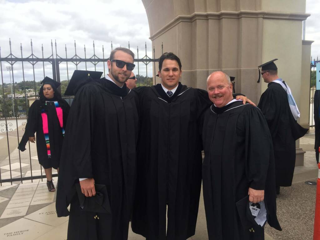 Ryan Opeka poses with two graduates at the University of San Diego MS-LEPSL commencement in 2017