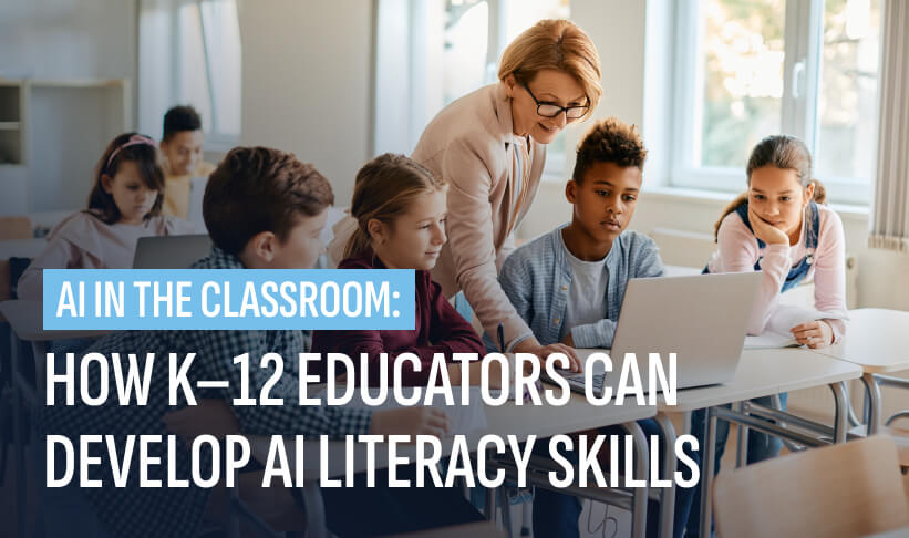Teacher helping young students with AI literacy skills in the classroom